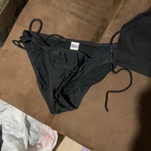 Swimsuit bottoms, sports bra, and bralette